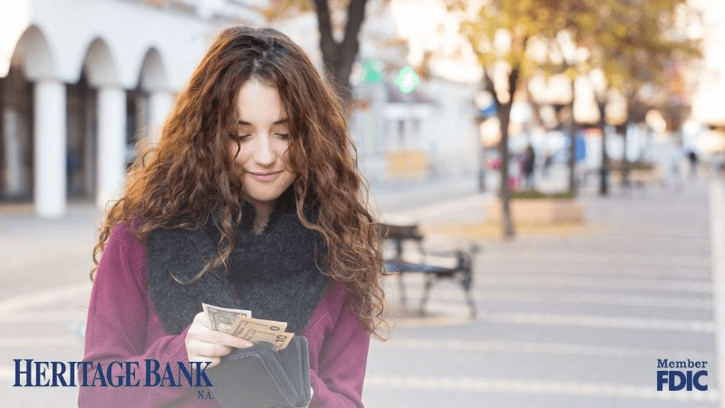 HBNA Blog – How to Protect Your Cash from Jugging copy (1) woman holding cash