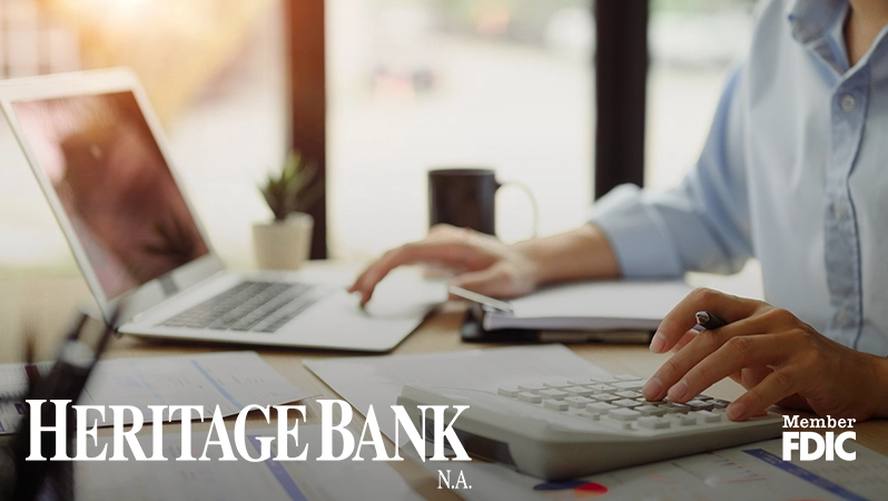 HBNA Blog- Overdrafts Made Simple person typing at their laptop